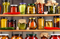 Food in jars on a shelf in a pantry